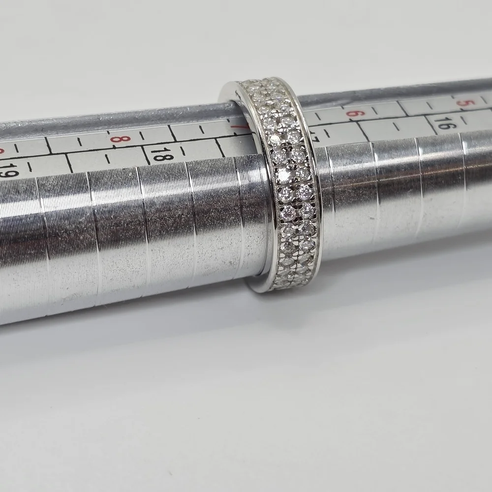 This is a 2 Row Moissanite Diamonds Band . S925 Silver. vvs1 D. size 7